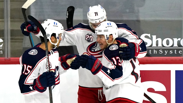 Cam Atkinson, Michael Del Zotto and Nick Foligno celebrate