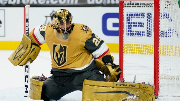 Vegas Golden Knights goaltender Marc-Andre Fleury throws on his