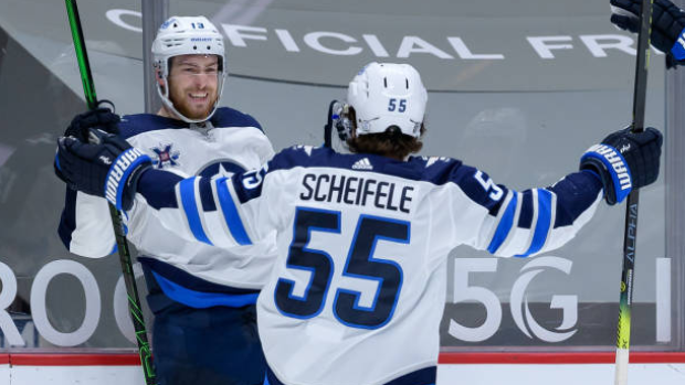 Pierre-Luc Dubois and Mark Scheifele celebrate