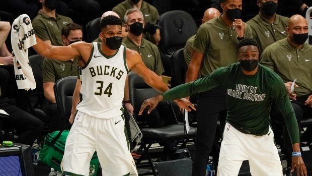 Giannis Antetokounmpo and Thanasis Antetokounmpo celebrate