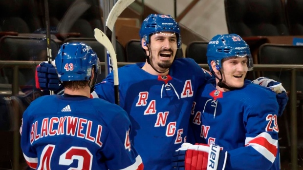 Colin Blackwell, Chris Kreider, and Adam Fox