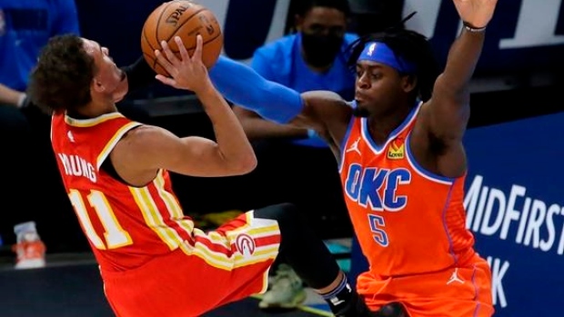Trae Young Lu Dort, The Canadian Press Trae Young Lu Dort