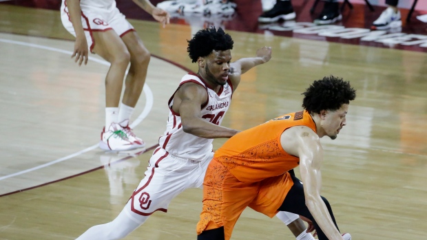 Cade Cunningham (2) goes against Elijah Harkless (24), The Canadian Press Cade Cunningham (2) goes against Elijah Harkless (24)