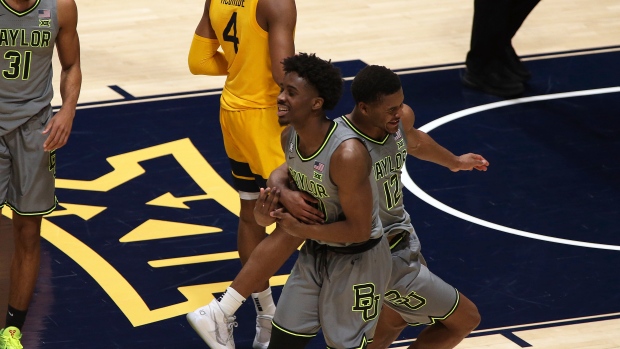 Baylor guards Adam Flagler and Jared Butler (12) celebrate the team's win over West Virginia , The Canadian Press Baylor guards Adam Flagler and Jared Butler (12) celebrate the team's win over West Virginia