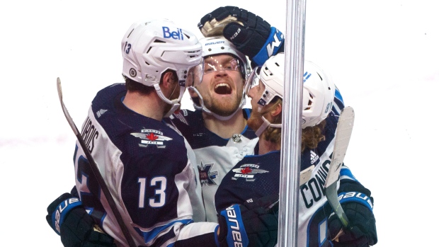 Pierre-Luc Dubois celebrates game winning goal with teammates , The Canadian Press Pierre-Luc Dubois celebrates game winning goal with teammates
