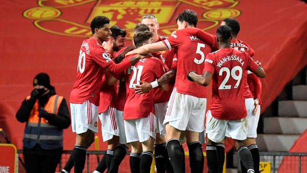 Manchester United players celebrate, The Canadian Press Manchester United players celebrate