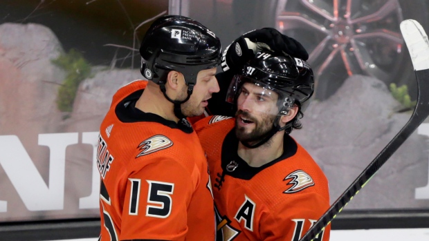Adam Henrique, right, celebrates his overtime goal with center Ryan Getzlaf