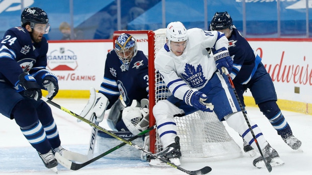 Zack Hyman, Connor Hellebuyck, The Canadian Press Zack Hyman, Connor Hellebuyck