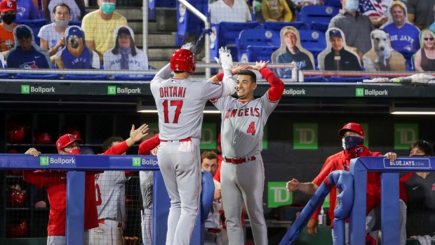 Los Angeles Angels' Jose Iglesias greets Shohei Ohtani