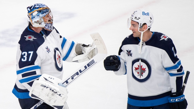 Connor Hellebuyck and Dylan DeMelo