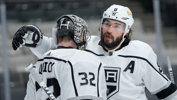 Los Angeles Kings defenseman Drew Doughty hugs goaltender Jonathan Quick