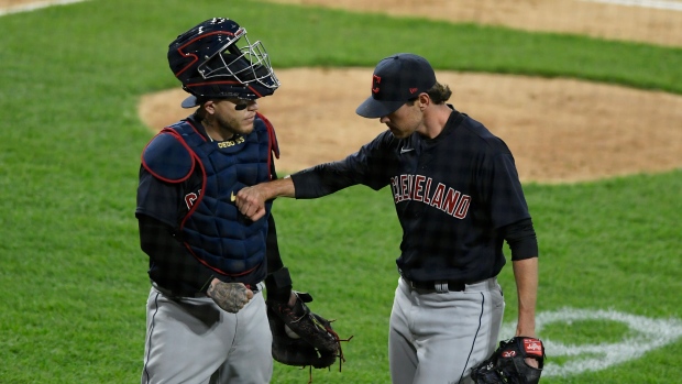 Shane Bieber, right, celebrates with catcher Roberto Perez, The Canadian Press Shane Bieber, right, celebrates with catcher Roberto Perez