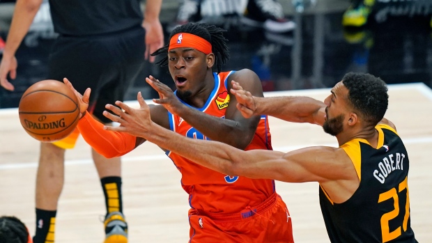 Thunder's Luguentz Dort passes the ball while defended by Jazz center Rudy Gobert, The Canadian Press Thunder's Luguentz Dort passes the ball while defended by Jazz center Rudy Gobert