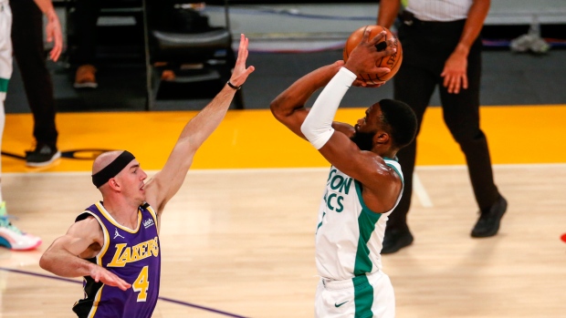 Jaylen Brown shoots over Alex Caruso