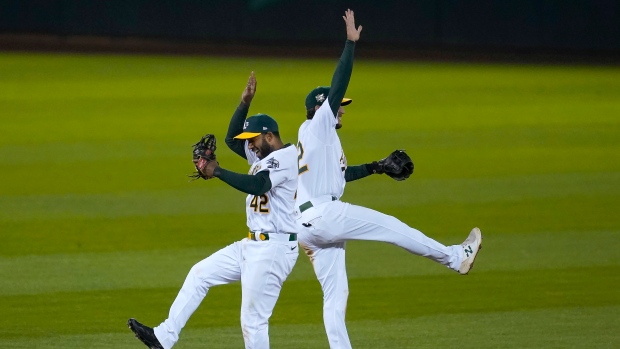 Elvis Andrus celebrates with Jed Lowrie