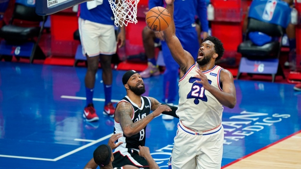 Joel Embiid, Marcus Morris, The Canadian Press Joel Embiid, Marcus Morris