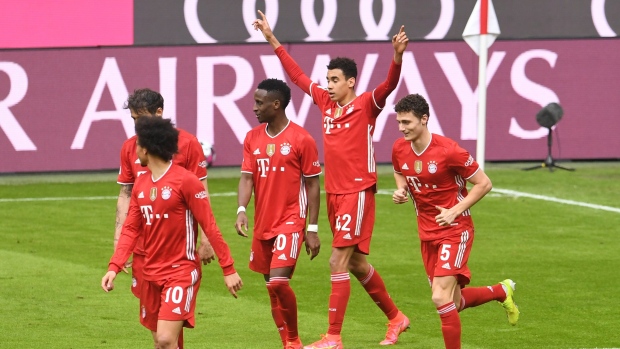 Jamal Musiala and Bayern Munich celebrate