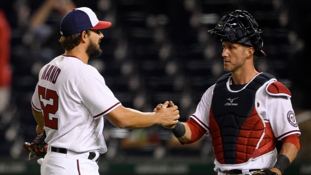 Brad Hand and catcher Yan Gomes