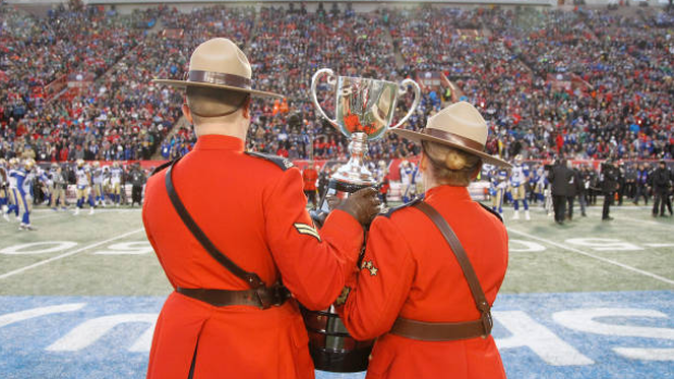 Mounties carry the Grey Cup, Getty Images Mounties carry the Grey Cup