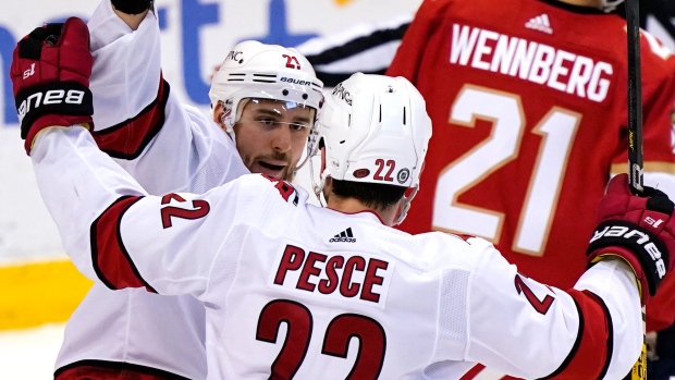Nino Niederreiter and Brett Pesce, The Canadian Press Nino Niederreiter and Brett Pesce