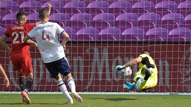 Toronto FC midfielder Jonathan Osorio scores against Vancouver Whitecaps, The Canadian Press Toronto FC midfielder Jonathan Osorio scores against Vancouver Whitecaps