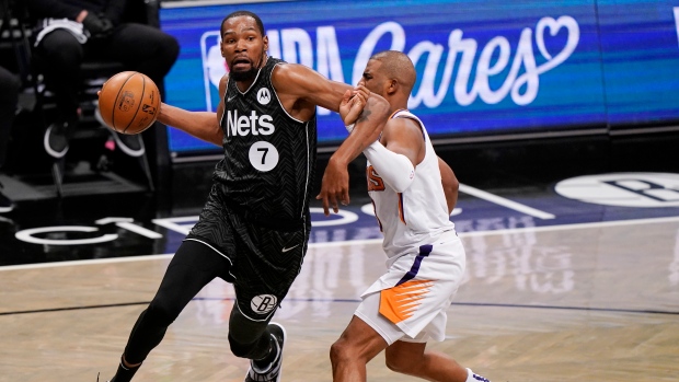 Kevin Durant, Chris Paul, The Canadian Press Kevin Durant, Chris Paul