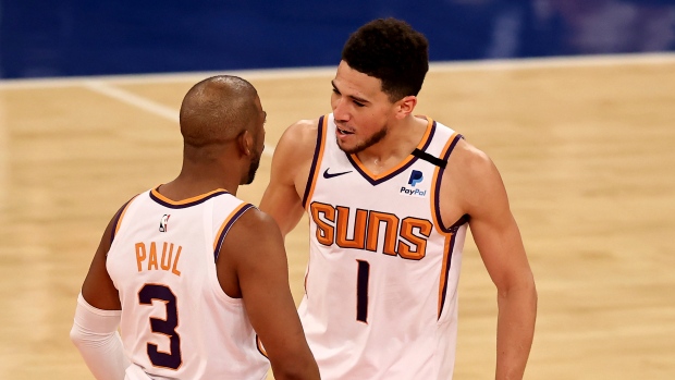 Chris Paul, Devin Booker, The Canadian Press Chris Paul, Devin Booker