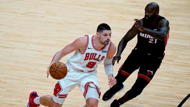 Nikola Vucevic, Dewayne Dedmon, The Canadian Press Nikola Vucevic, Dewayne Dedmon