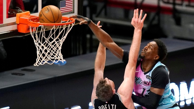 Bam Adebayo dunks over Jakob Poeltl