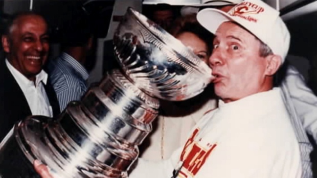 Byron J. Seaman drinks from the Stanley Cup after the Calgary Flames won it in 1989. 