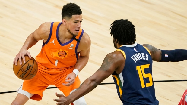Devin Booker, Derrick Favors, The Canadian Press Devin Booker, Derrick Favors
