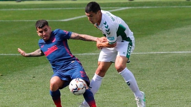 Atletico Madrid's Angel Correa and Elche's Diego Gonzalez