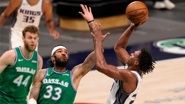 Buddy Hield shoots against Dallas Mavericks