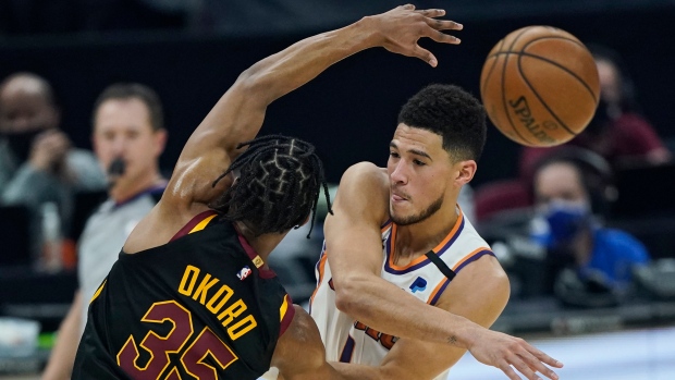 Devin Booker and Isaac Okoro, The Canadian Press Devin Booker and Isaac Okoro