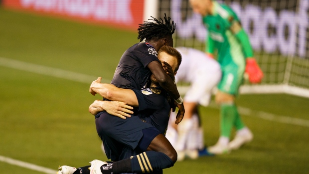 Philadelphia Union's Kacper Przybylko and Olivier Mbaizo, The Canadian Press Philadelphia Union's Kacper Przybylko and Olivier Mbaizo