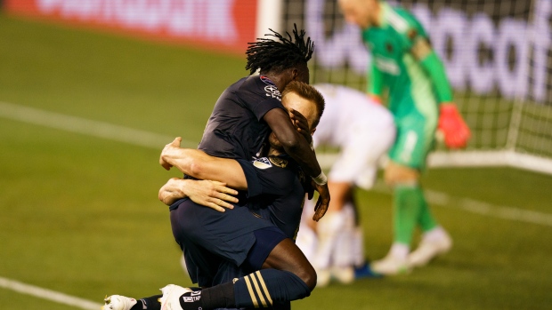 Philadelphia Union's Kacper Przybylko and Olivier Mbaizo