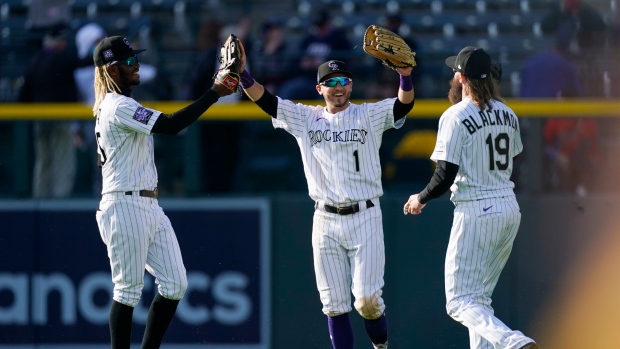 Colorado Rockies celebrate, The Canadian Press Colorado Rockies celebrate