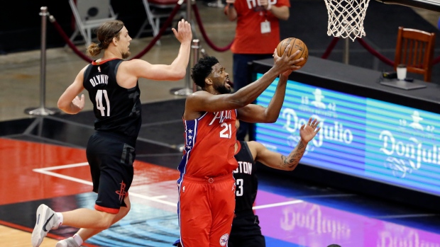 Philadelphia 76ers' Joel Embiid (21) gets a shot up past the Houston Rockets, The Canadian Press Philadelphia 76ers' Joel Embiid (21) gets a shot up past the Houston Rockets