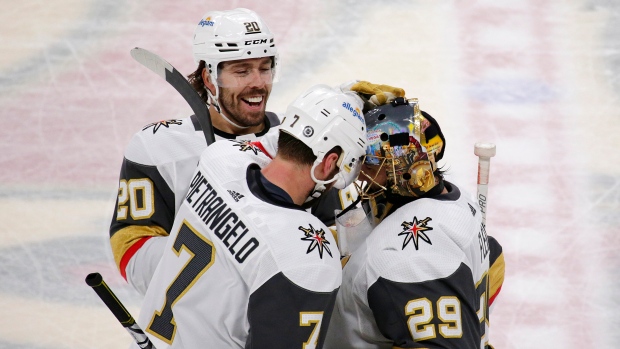 Marc-Andre Fleury celebrates with teammates , The Canadian Press Marc-Andre Fleury celebrates with teammates