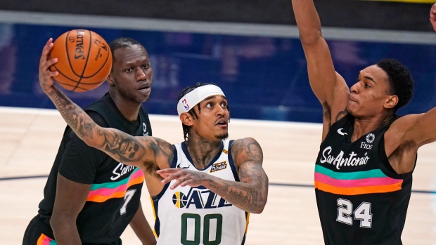 Utah Jazz's Jordan Clarkson attempts a shot against the San Antonio Spurs