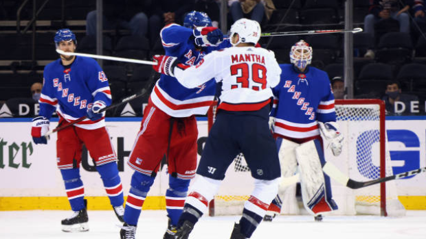 Pavel Buchnevich cross-checks Anthony Mantha, Getty Images Pavel Buchnevich cross-checks Anthony Mantha