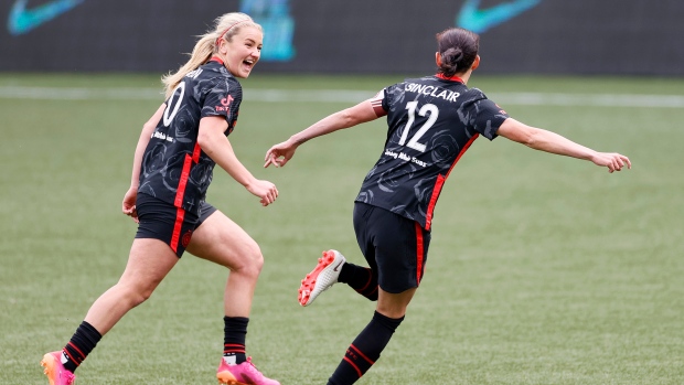 Christine Sinclair celebrates with  Lindsey Horan 