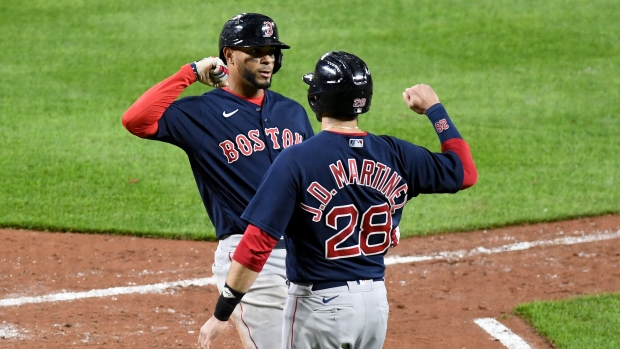 Boston Red Sox's Xander Bogaerts and J.D. Martinez 