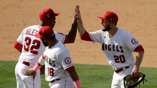 Raisel Iglesias and Jared Walsh, The Canadian Press Raisel Iglesias and Jared Walsh