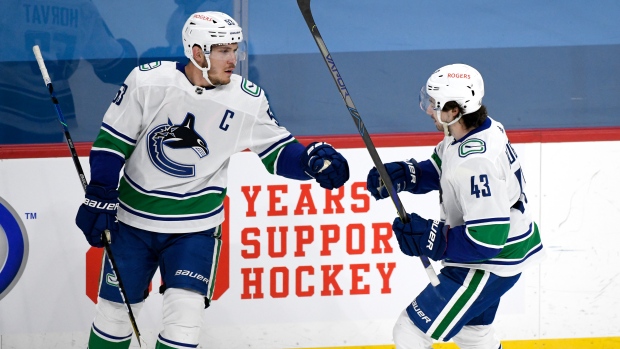 Bo Horvat, Quinn Hughes, The Canadian Press Bo Horvat, Quinn Hughes