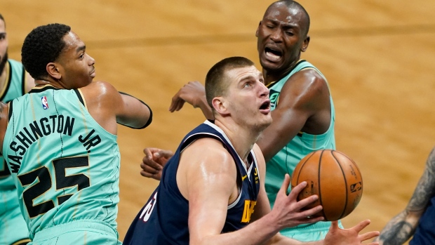 Nikola Jokic, PJ Washington, Bismack Biyombo, The Canadian Press Nikola Jokic, PJ Washington, Bismack Biyombo