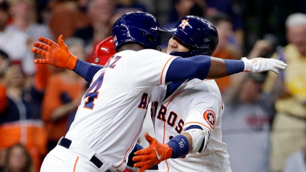 Yordan Alvarez, Yuli Gurriel , The Canadian Press Yordan Alvarez, Yuli Gurriel