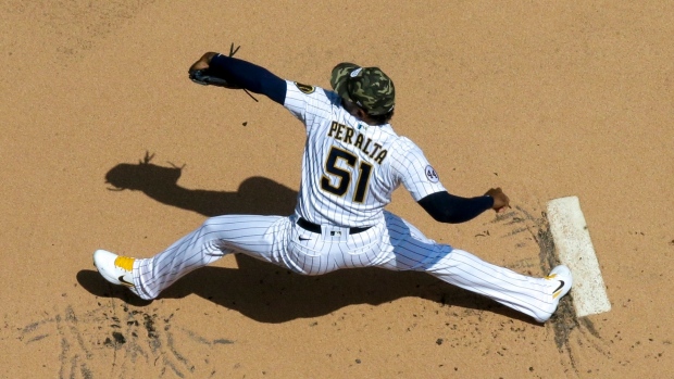 Freddy Peralta blanks Atlanta Braves, bullpen falters, Milwaukee Brewers  survive 