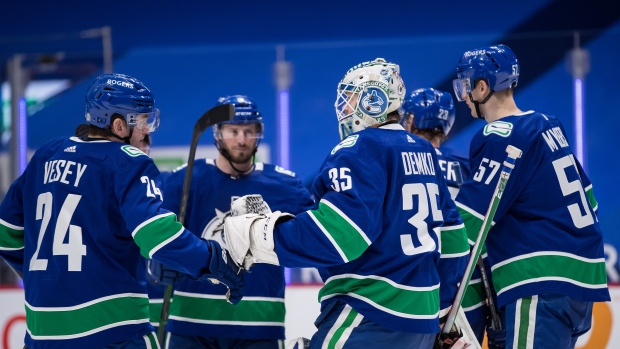 Vancouver Canucks celebrate, The Canadian Press Vancouver Canucks celebrate