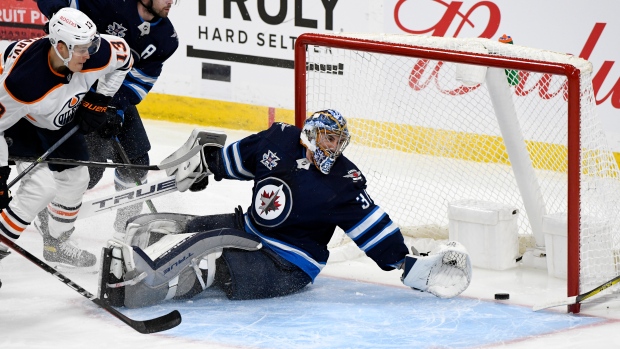 Connor Hellebuyck Jesse Puljujarvi